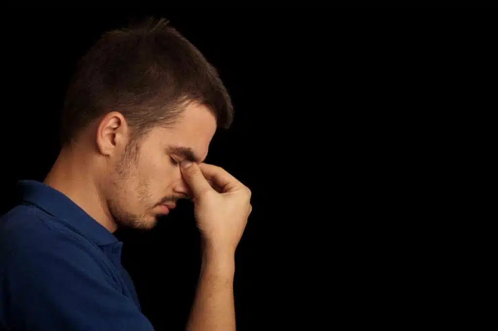 depressed man eyes closed