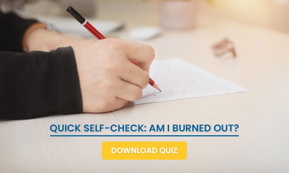 Person filling out a burnout self check quiz with a red pen at a desk, promoting mental health awareness and self assessment. 